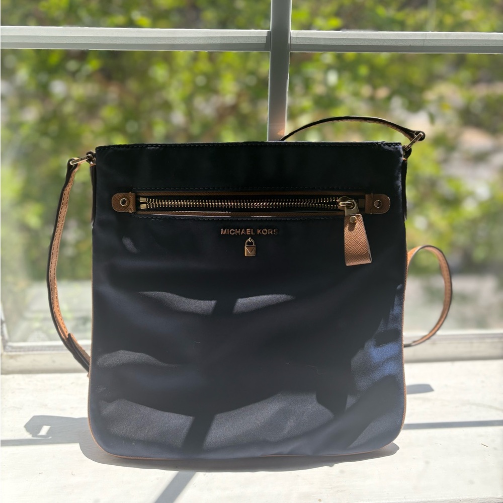 Michael Kors Black and Tan Crossbody Bag with Sleek Design